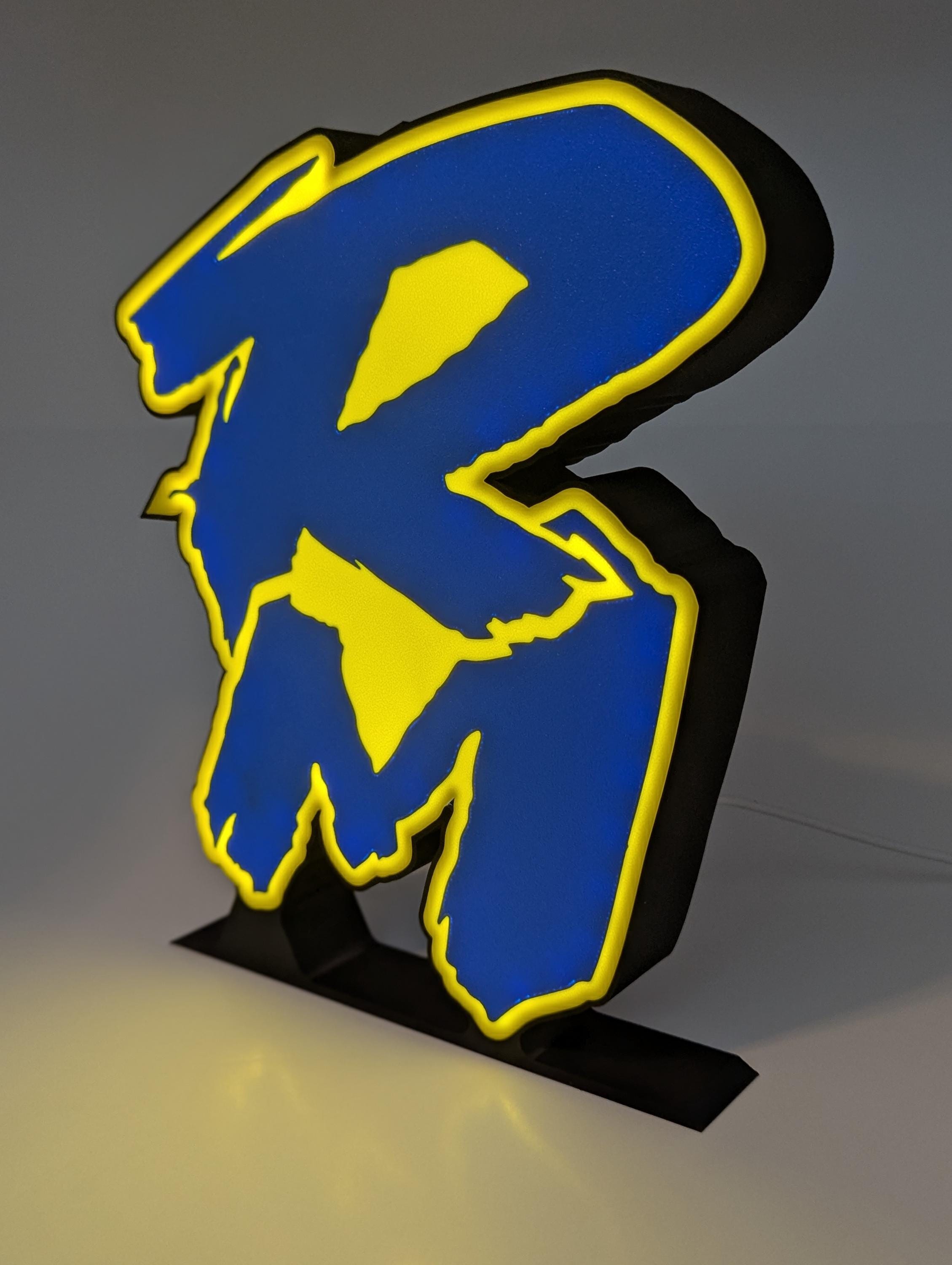 Suzuki RM 3D printed LED sign illuminated in a dark room