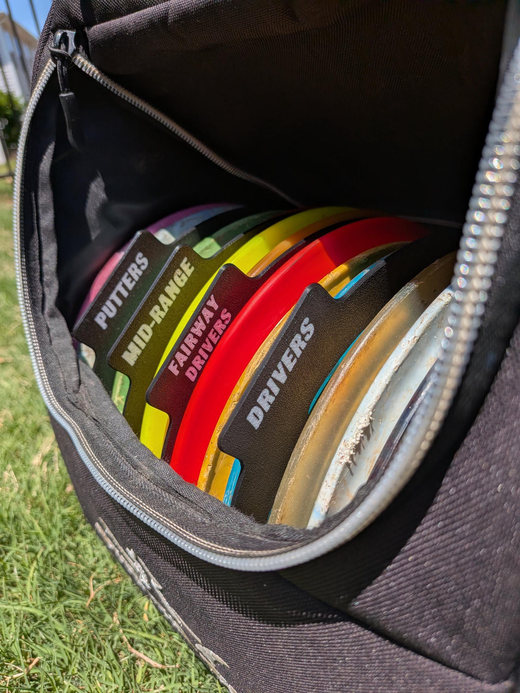 Four labeled disc golf disc separators in custom colors