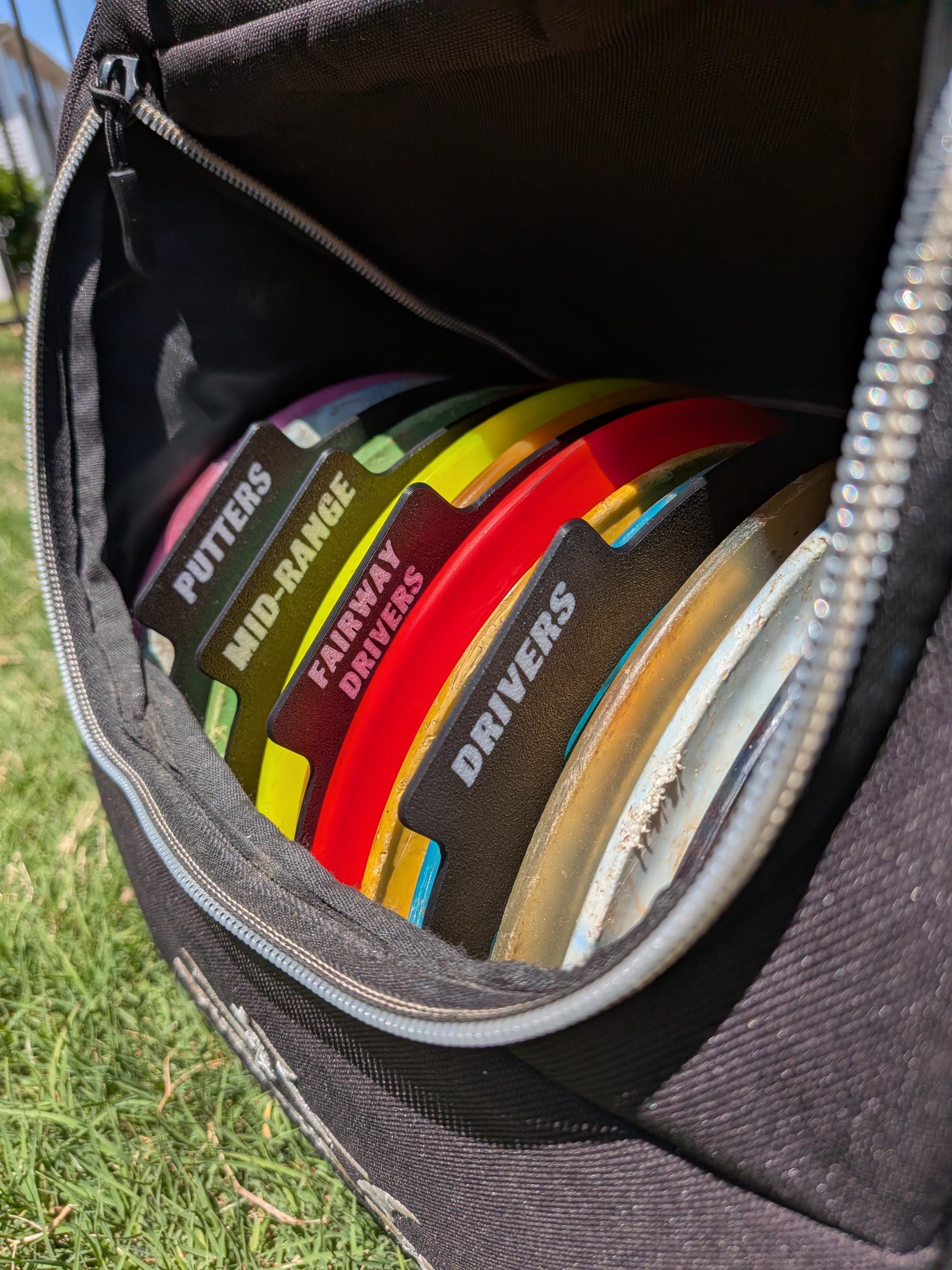 Four labeled disc golf disc separators in custom colors